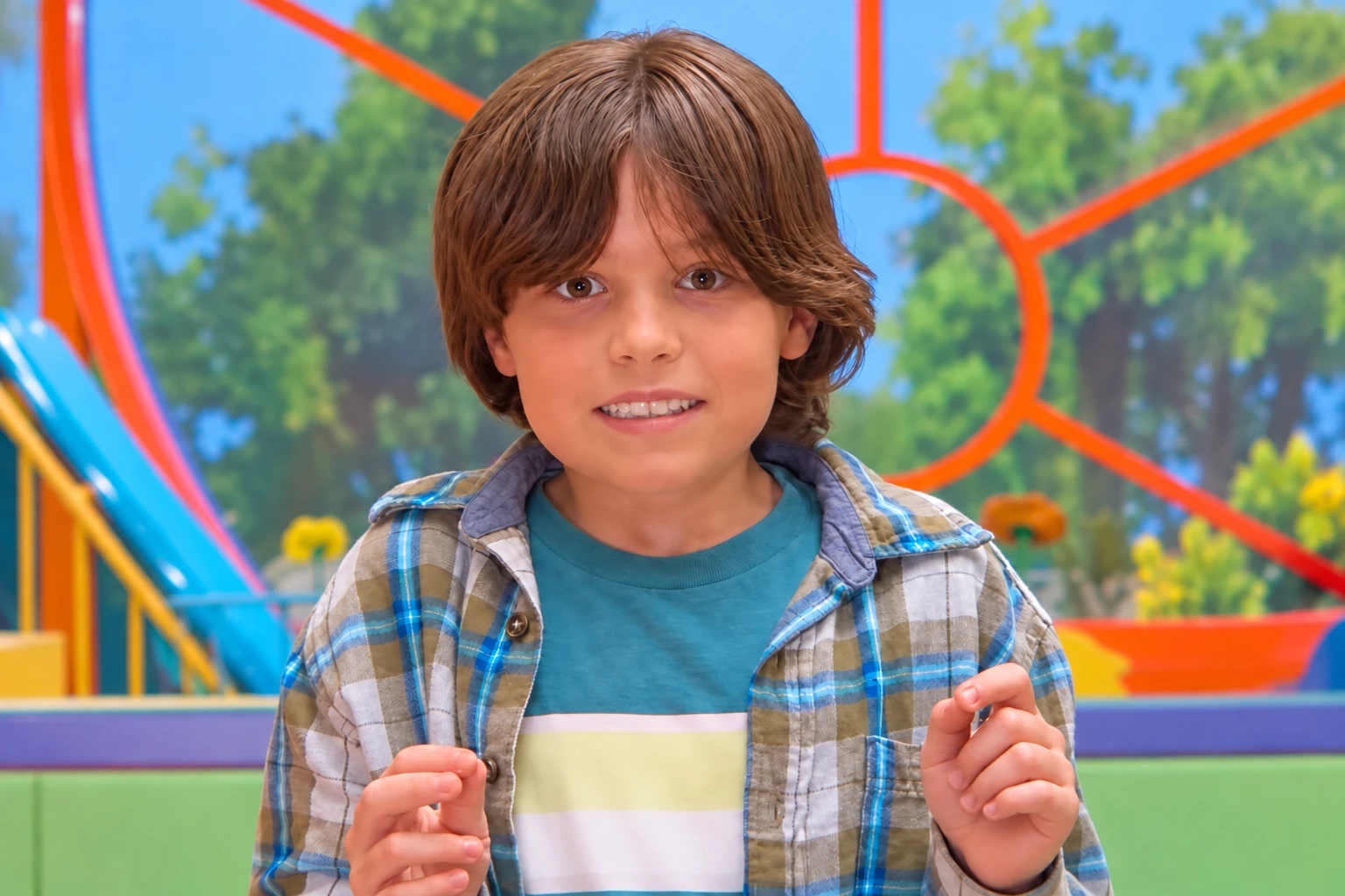 Luke Speakman as Josh in Buddy, wearing a checked shirt at a playground