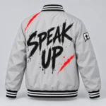 Stone gray SPEAK//UP statement jacket with black Speak Up brush lettering and red back accents, rear view
